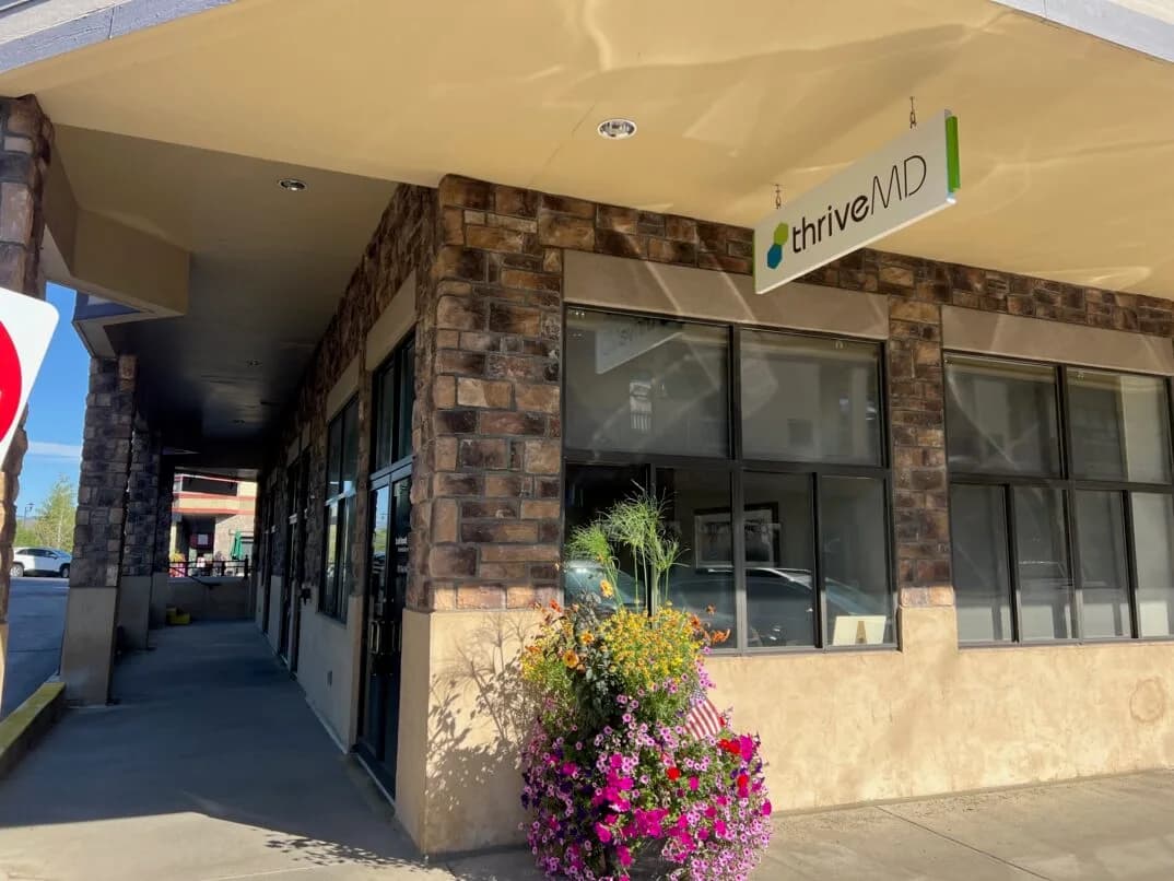 ThriveMD office entrance and hanging sign at the Riverwalk in Edwards, Colorado