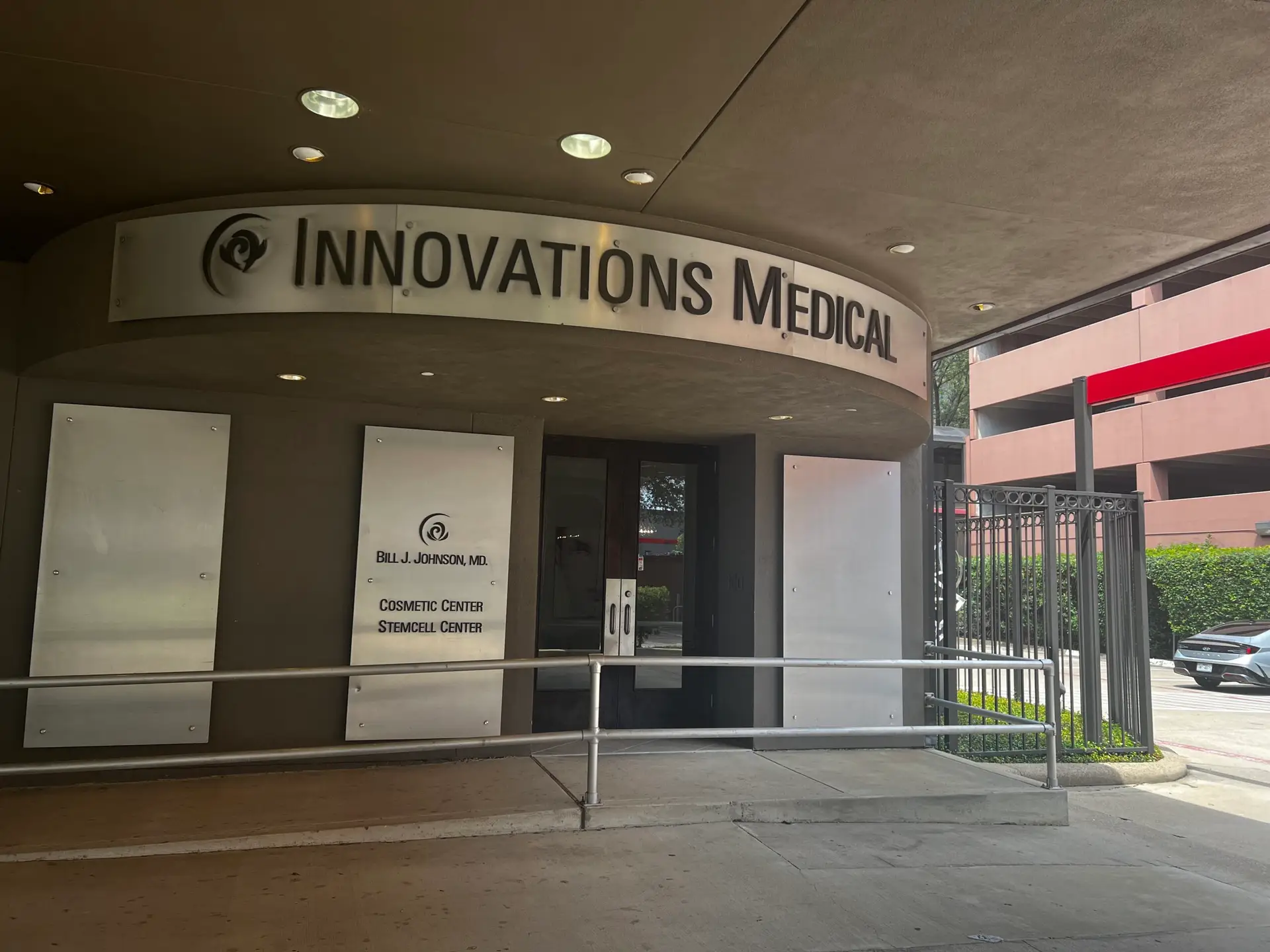 Covered entrance to the Innovations Medical building in Dallas, Texas, signed for Bill J. Johnson MD Cosmetic Center and Stemcell Center
